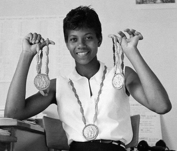 It’s the 60th anniversary of Wilma Rudolph smashing records and becoming a 3x Olympic gold medalist. To honor her, here is a photo  of Wilma with handsome men.