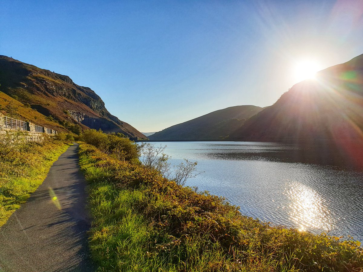 Caban-coch reservoir. The path is part of the old railway line.