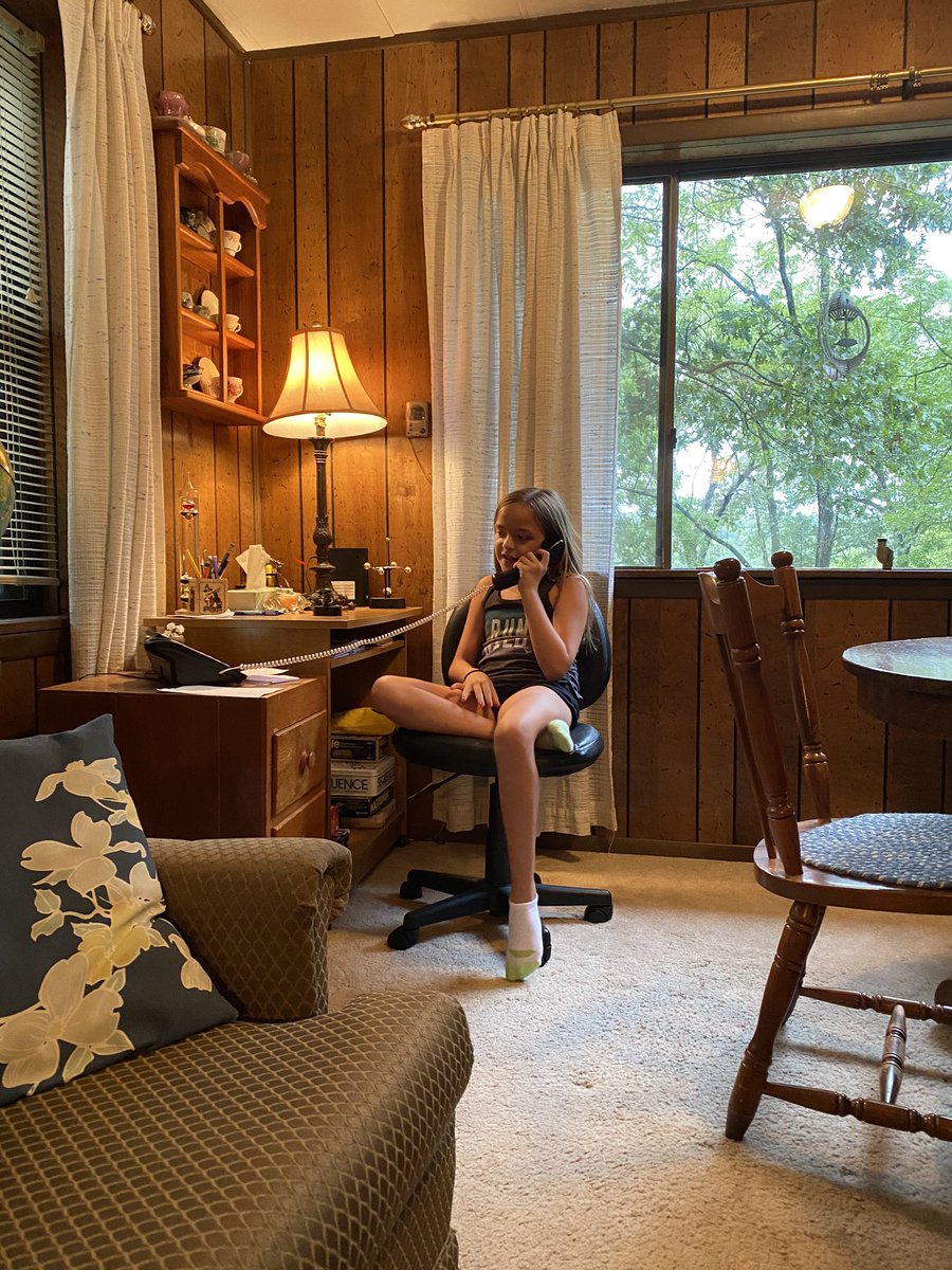 She is genuinely enthralled with a functional land line phone. How different her world is!