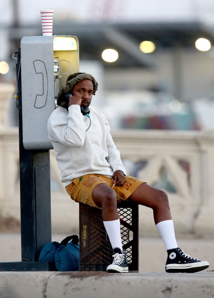 Kendrick Lamar seen filming a new music video yesterday talking on a payphone. A way too premature dissection of this photo? Ok, why not.A telephone is a recurring motif in Kendrick’s discography, many times as a symbolic means of connecting with God and family. 1/8