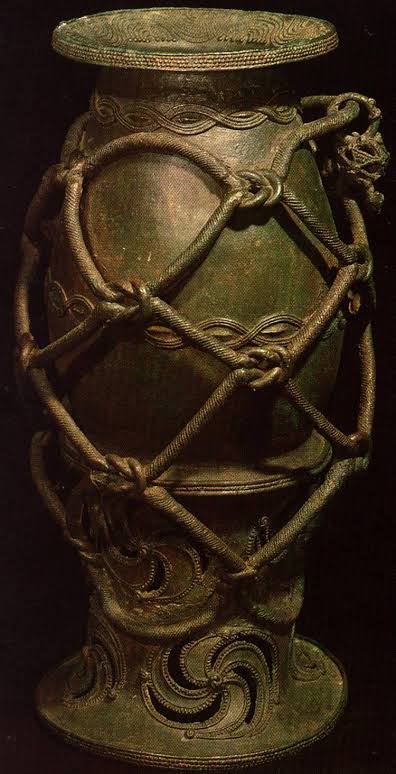 These artifacts are likely from the burial of a highly important person. They include ritual vessels , pendants, crowns and breastplates, jewelry, ceramics , copper and iron objects, and thousands of glass beads.