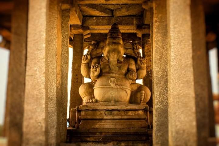 - Sasivekalu Temple World Heritage Hampi, KarnatakaHuge monolithic block of rock statue of Lord Ganesha around 8 feet tall.- Ganesha in an arched 'Torana' carved in relief on a pillar at Hampi. #VijayanagataEmpire  #ಕರ್ಣಾಟಸಾಮ್ರಾಜ್ಯ  #ಹಂಪೆ #GaneshChaturthi2020  @BharatTemples_