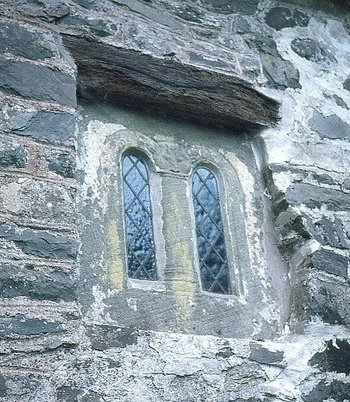 There's a small ancient window carved from a single block of sandstone with a face on top of the pillar which is thought to be Saxon - as is the simple stone font.4/