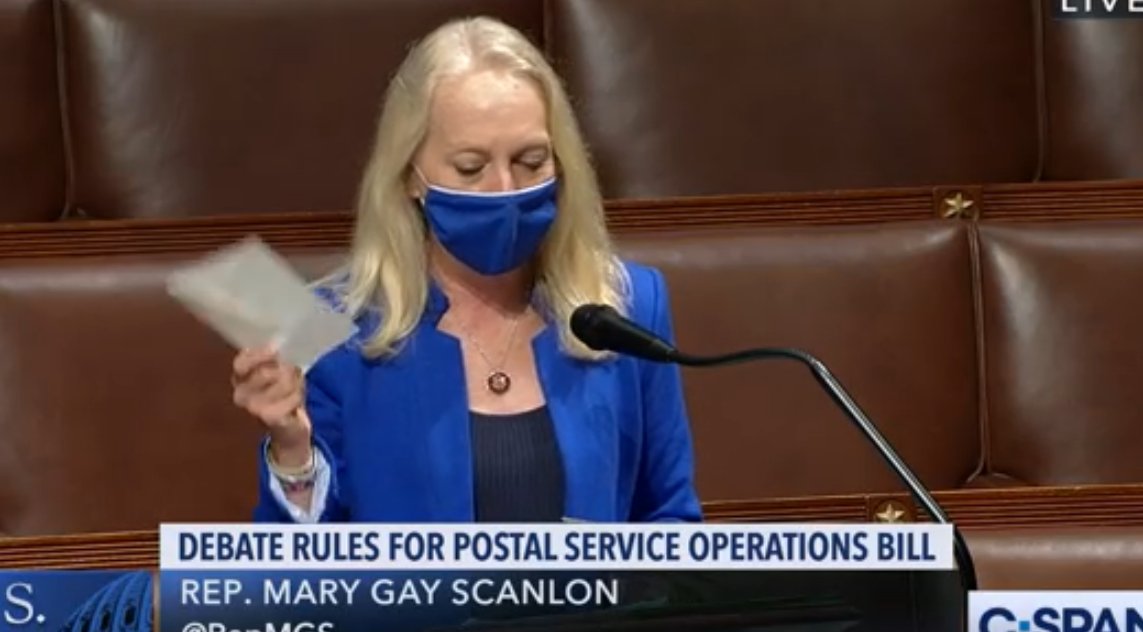 Rep. Mary Gay Scanlon waves several letters sent to her office from constituents saying they aren't receiving mail on time, aren't seeing carriers for more than 10 days at a time, biz invoices not being received timely etc.