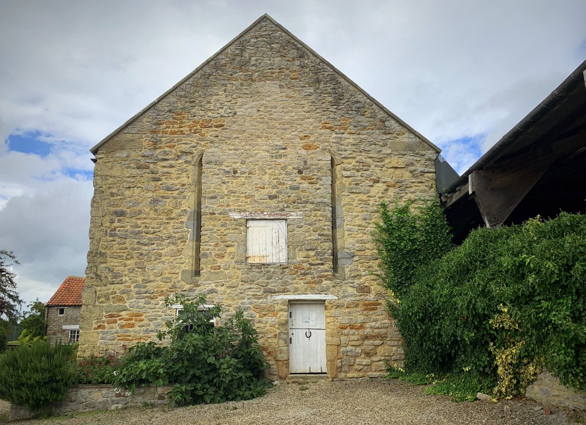 And opposite the church is this medieval great hall, which is now used as a barn, but deserves better.