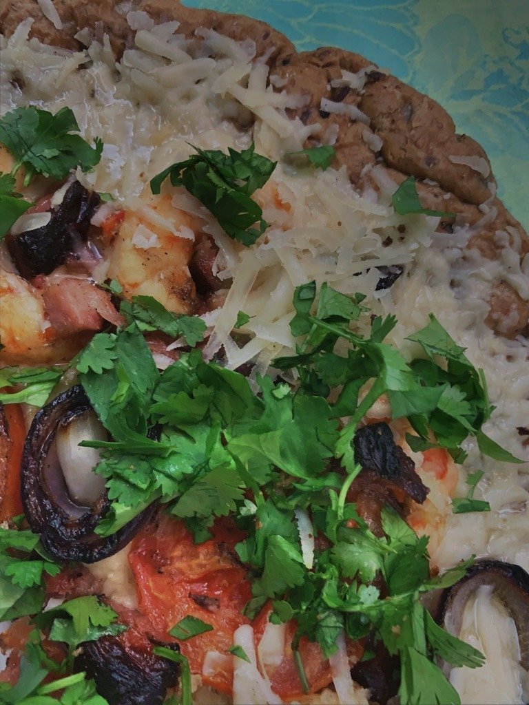 Homemade pizza over fire.  Grilled red onion, tomato, pancetta, shrimp, cilantro and goat cheese
#pizza