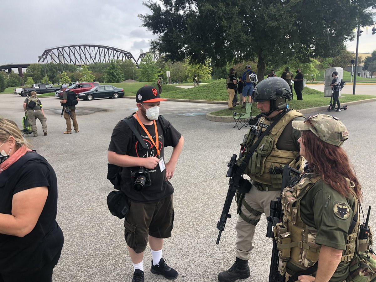 At this point it’s started to rain, so some of them are getting into their cars.One interesting development is that the group has a new name and no longer identifies with III%.They are now the “National Patriotic Defense Team.”