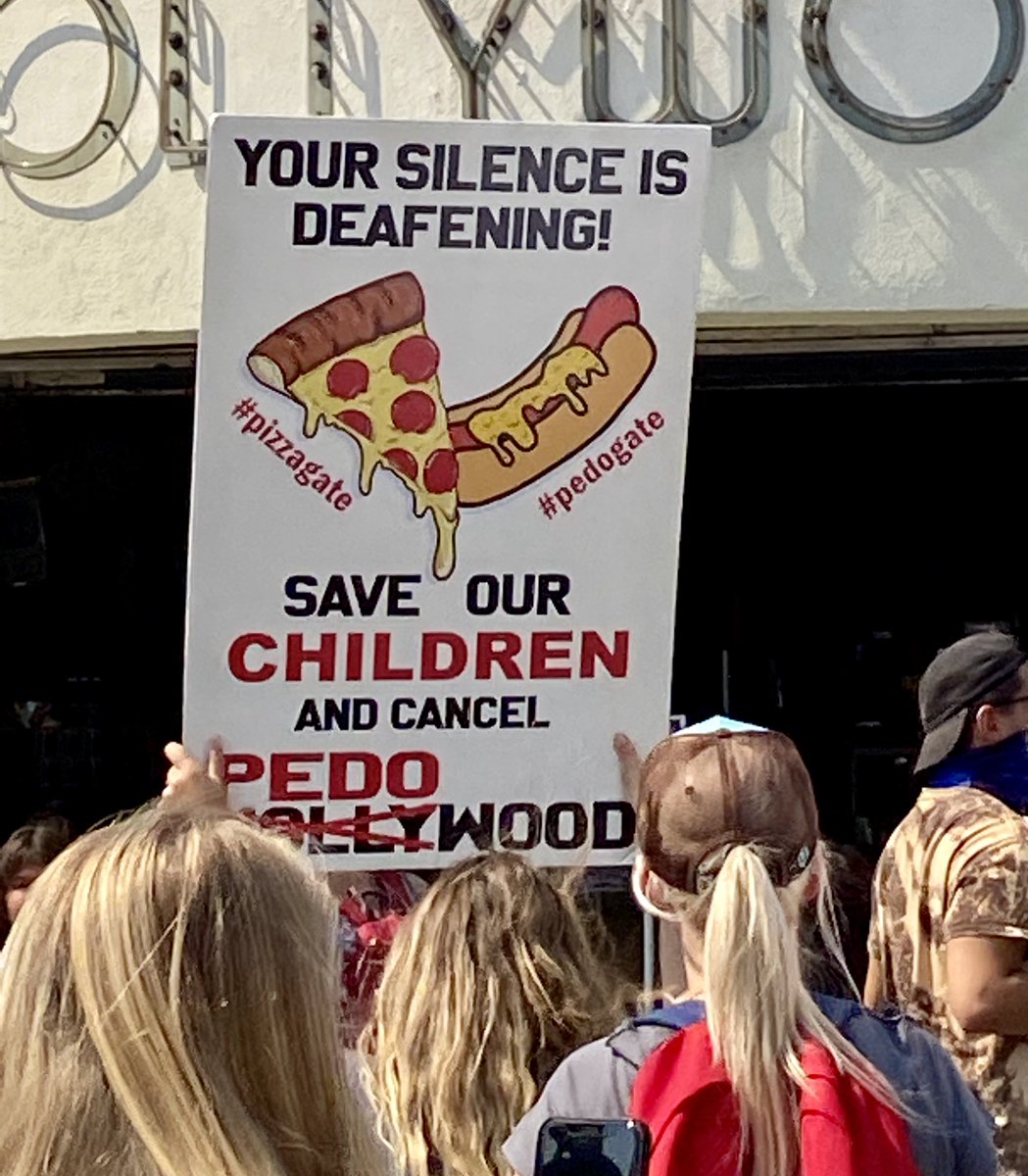 More signs from today’s QAnon rally, where hundreds of protesters marched down the Hollywood Walk of Fame in 93° heat chanting things like “kill all pedophiles”