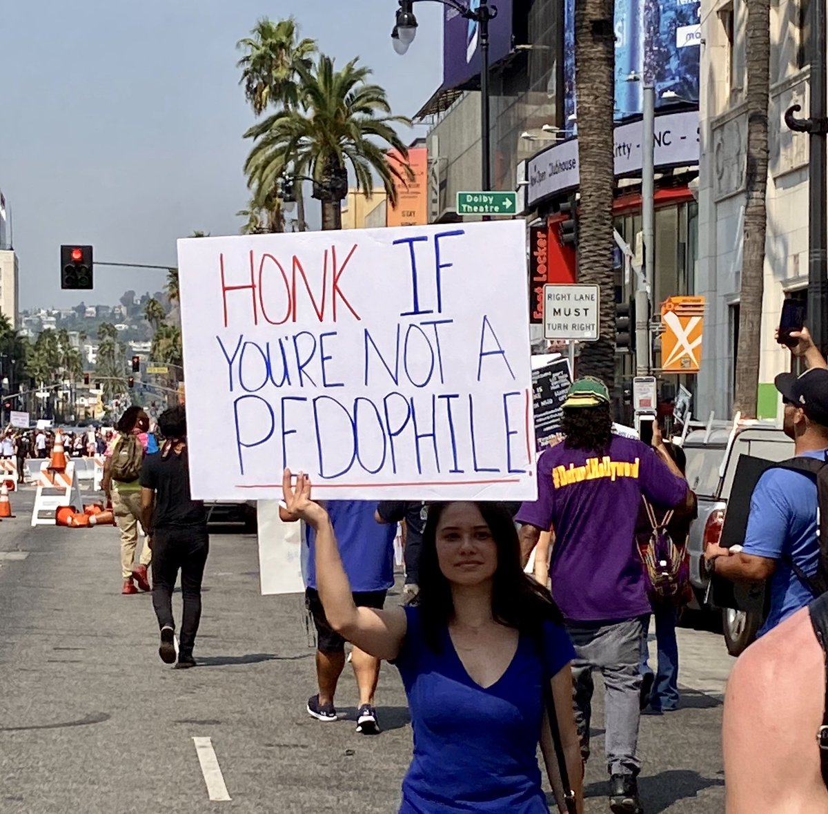 More signs from today’s QAnon rally, where hundreds of protesters marched down the Hollywood Walk of Fame in 93° heat chanting things like “kill all pedophiles”