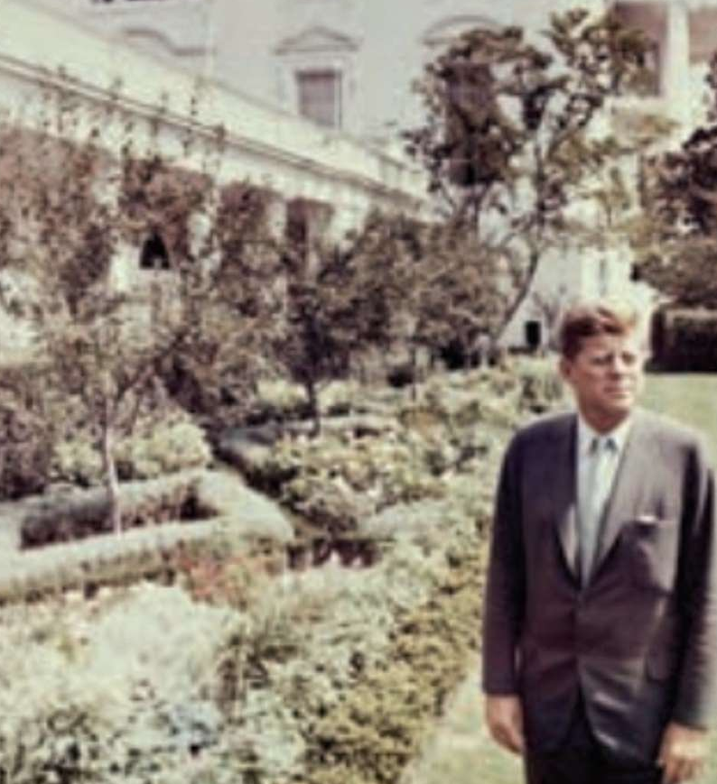 Photos of President John F. Kennedy in the Rose Garden including the iconic image of President Bill Clinton as a teenager shaking hands with President Kennedy in the Rose Garden in 1963.