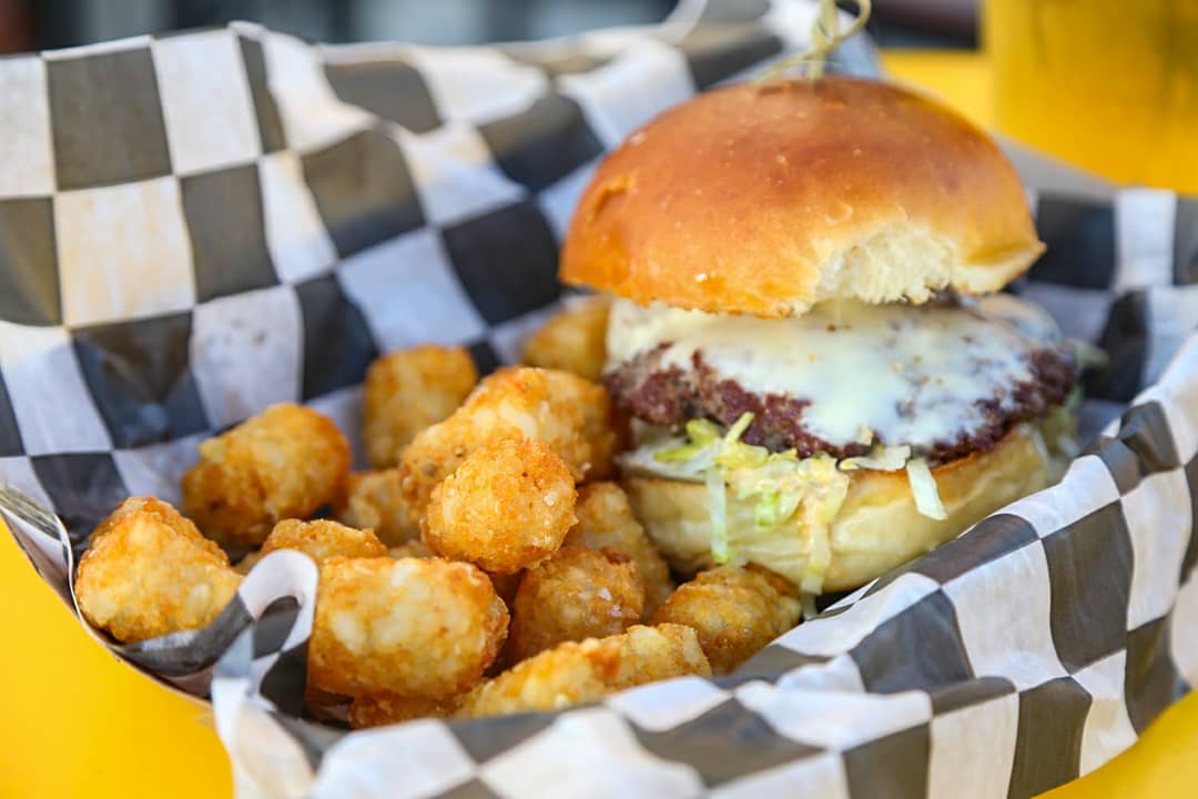 This is the Mighty Puck from  #ForestCityShuffleboard Two beef patties, American cheese, really "pucking" good sauce, pickle and shredded lettuce on an On the Rise bun.  #BurgerWeekCLE #ClevelandBurgerWeek  @CLEburgerweek