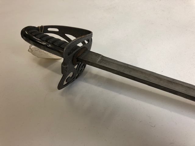 Within it this Volunteer Rifle Officer’s sword, 1830s/40s. Based on other swords like it we can assume it was a sword made for officers of that particular Volunteer Rifles unit (home defense volunteers trained to be army reserves) used by infantry (soldiers fighting on foot)