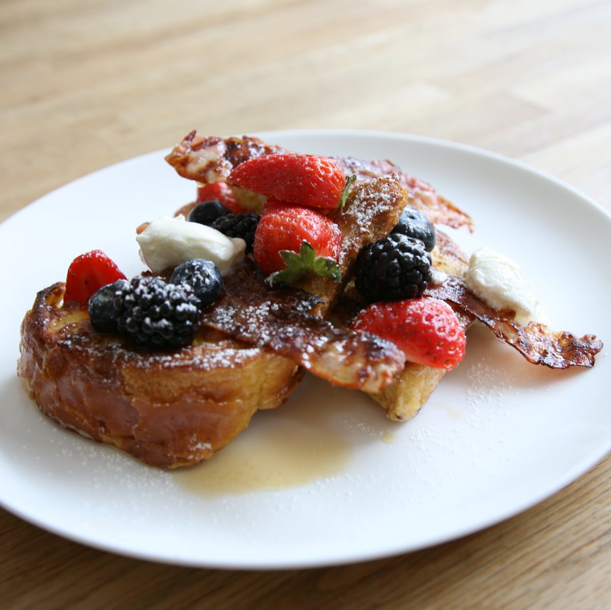 Next week's brunch special: based on a brioche loaf &amp; served with fresh summer berries, maple syrup, creamy yoghurt and crispy pancetta.