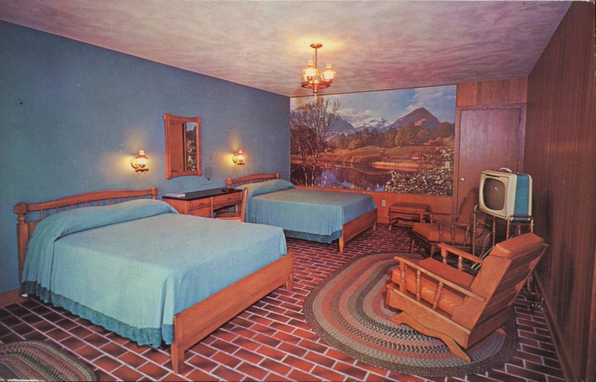 Completely unconnected (but spookily), a few hours later I was looking through my 50k photo archive of period images I use for  @Scarfolk and, by sheer chance, I spotted the same Alpine scene on the wall of a 1970s Tennessee motel room! 3/6