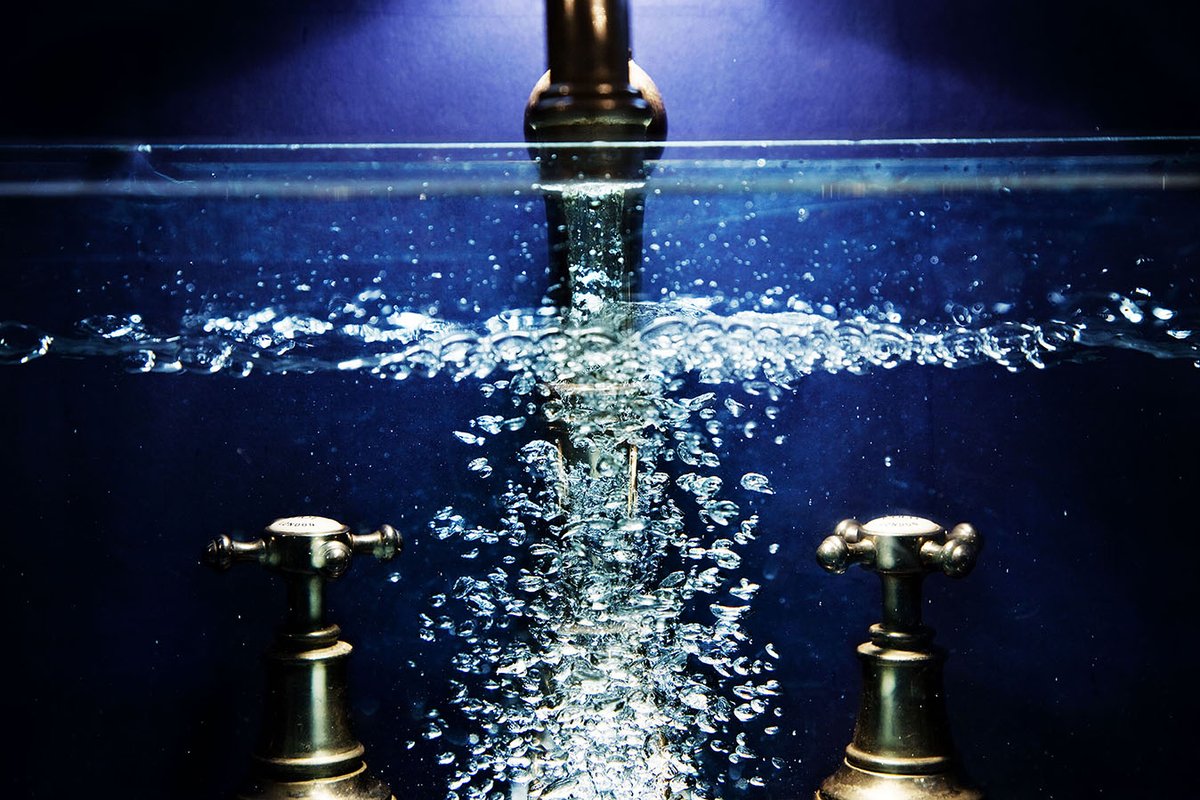 SUNDAY PHOTO OFFERING..- I rested a small fish tank on my kitchen sink, with a blue card behind, and filled it up... I'm calling it. "Fish Tank On My Kitchen Sink With A Blue Card Behind - Filling Up" #photography #image #water #bubbles