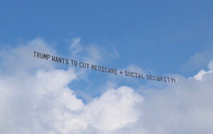 JoshuaHenne's tweet photo. Airplane banner about to head up &amp; down the South Jersey Shore from Cape May to LBI:  “TRUMP WANTS TO CUT YOUR MEDICARE &amp; SOCIAL SECURITY!!!” https://t.co/qJzjkGmpxS