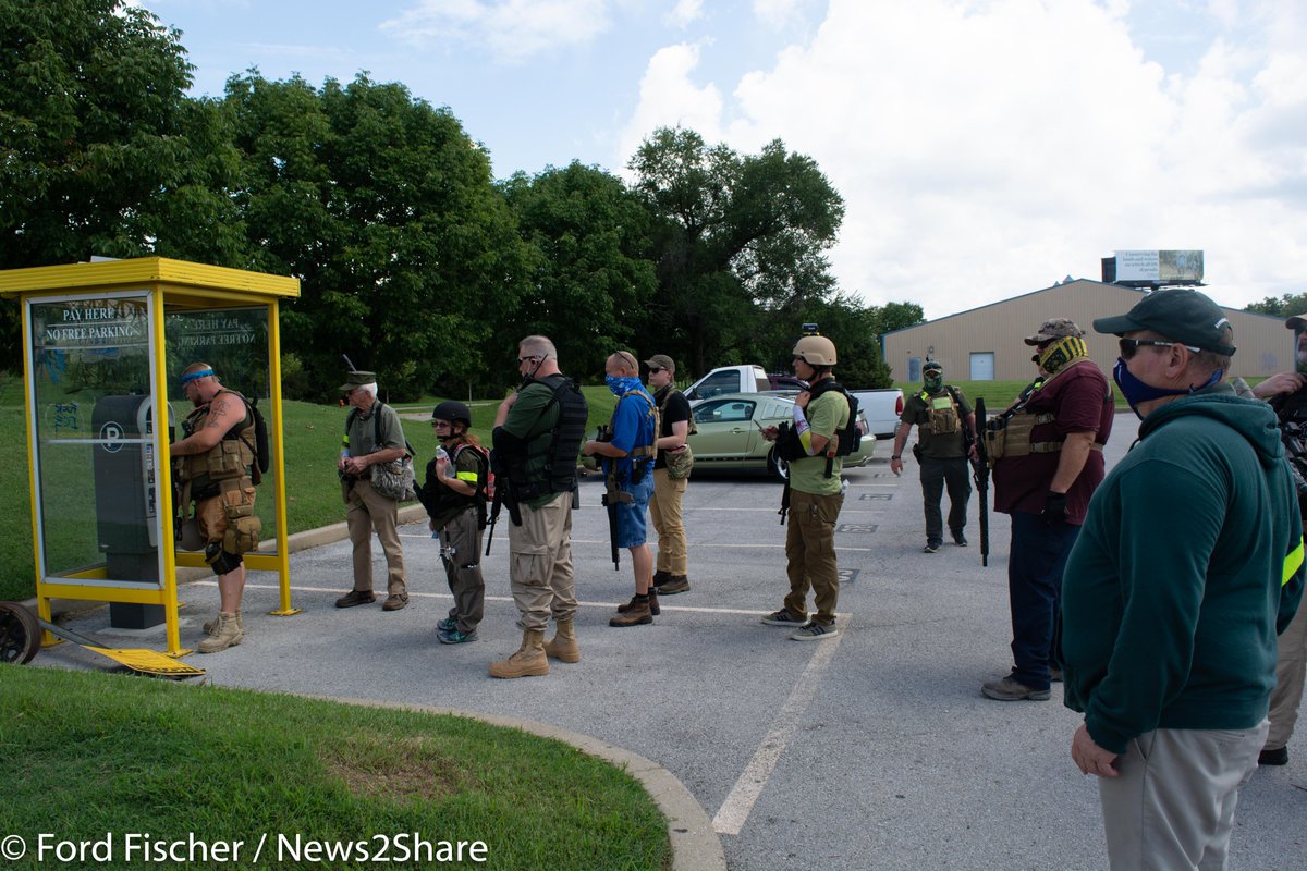 The lot was about a quarter full, and the militia members did indeed each pay the $3 parking fee.