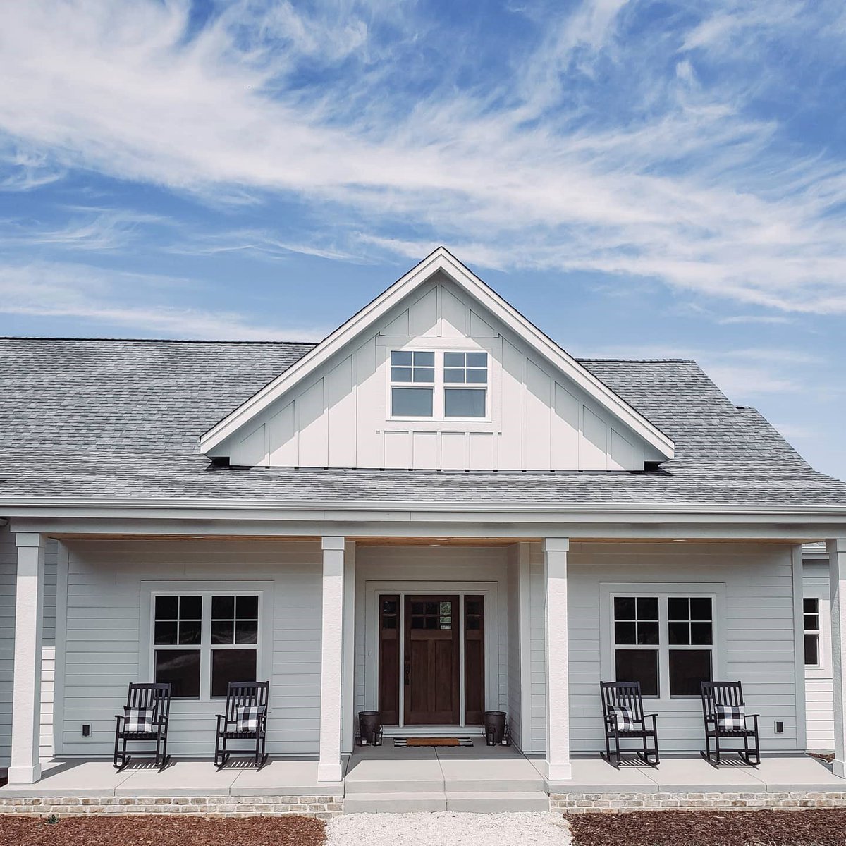 JamesHardie's tweet photo. Simple, timeless, and thoughtful style! The #HardiePlank lap #siding on the first floor of this #modernfarmhouse gives it visual width, while the #HardiePanel vertical siding in the gable provides height. See more beautiful homes just like this one: https://t.co/HJCi1KmO2o https://t.co/bBHzDVUE74