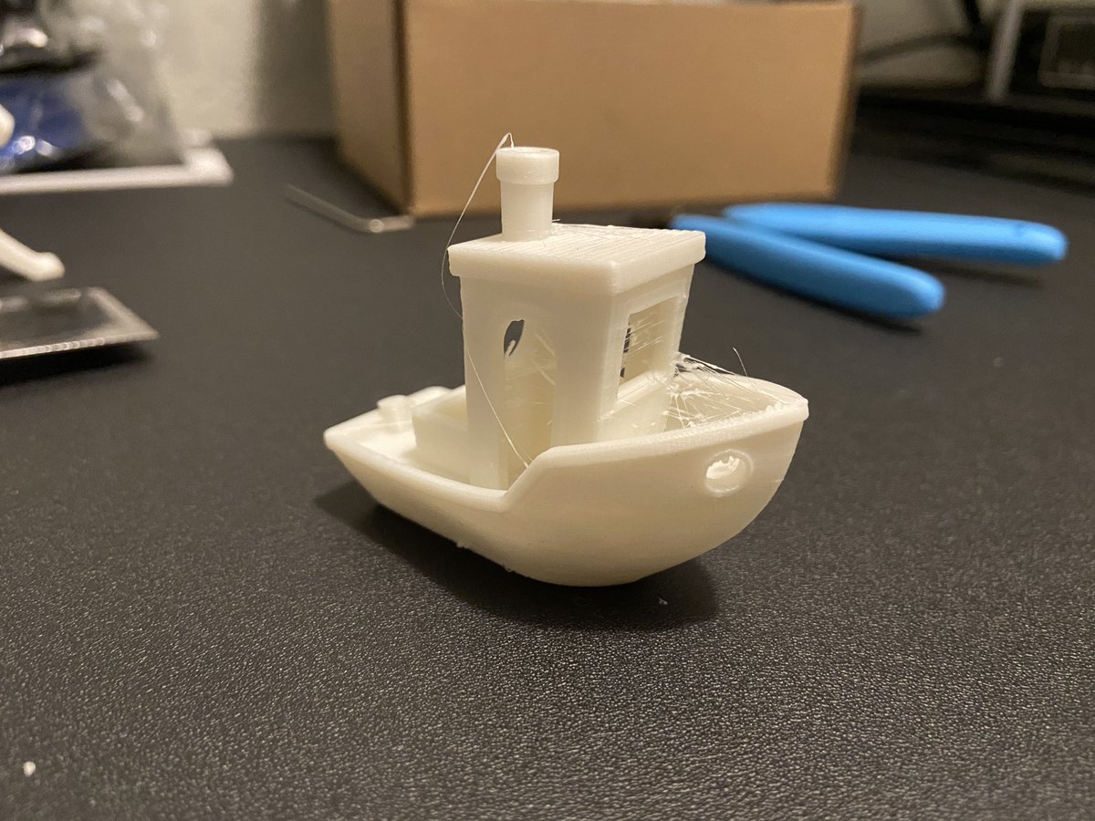 Got the sliver working and got my first benchy. Model looks great, just have really bad stringing. Currently printing a heat tower to see if heat is the issue.
