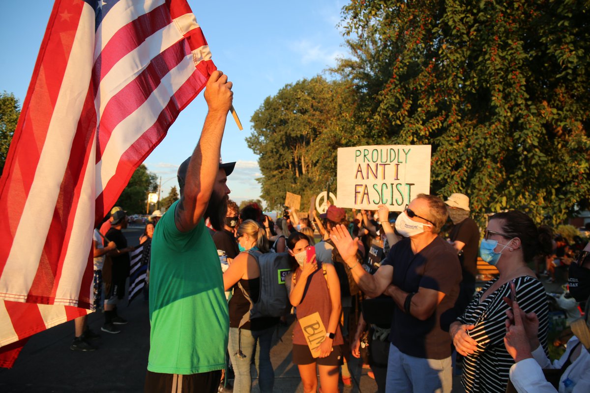 Across the street, a crowd waved flags: American flags, pro-police flags, Trump 2020 flags, and the Confederate flag. They chanted: “Go home commies, go home.” One woman’s t-shirt read: “Lying Josie has got to go.”