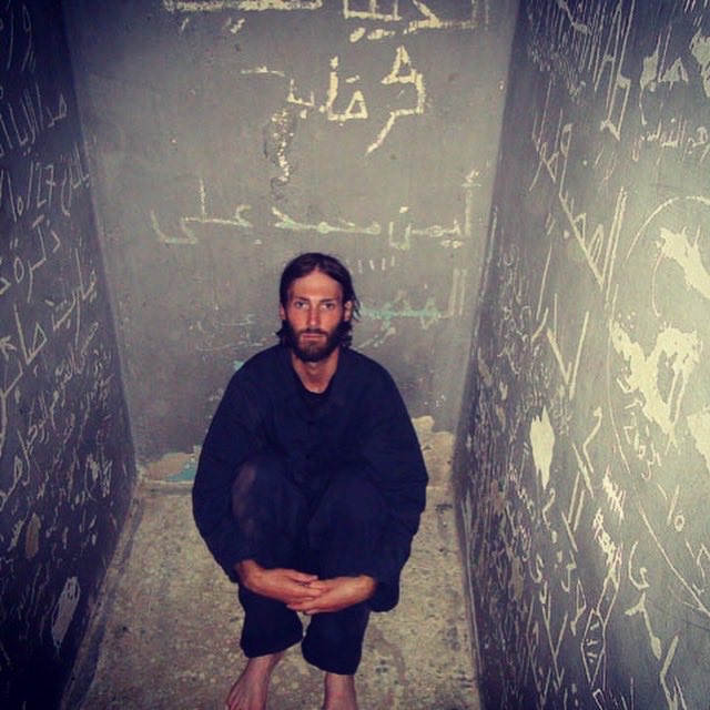 Matt_VanDyke's tweet photo. I escaped from Abu Salim Prison in #Libya 9 years ago today, on 8/24/11. I had been in solitary confinement for nearly 6 months as a #POW before escaping and returning to combat on the front line. Today thinking of POWs around the world suffering for a cause, waiting for freedom. https://t.co/3ksmDCda9n
