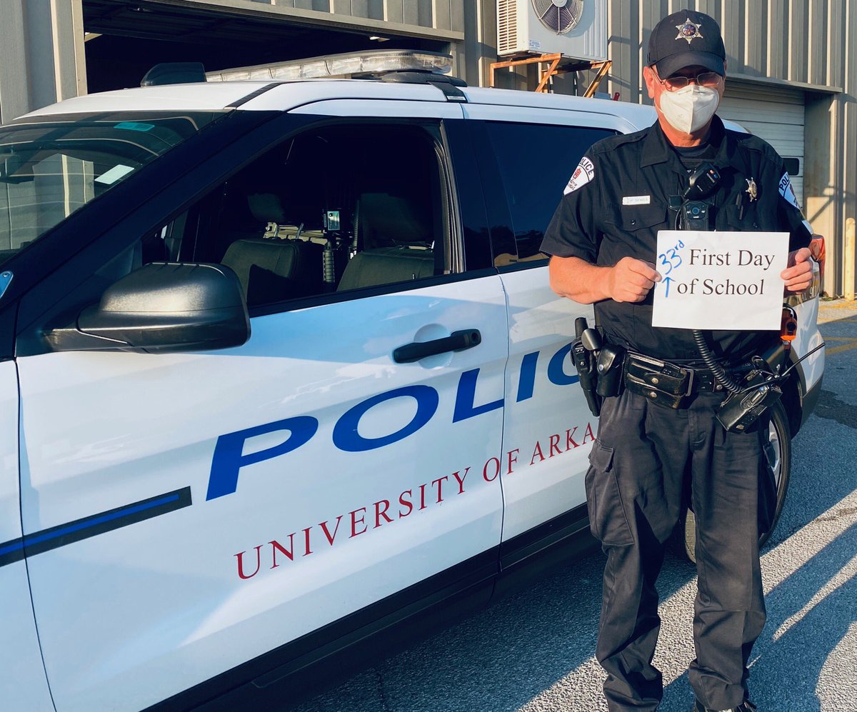 UARKPD's tweet photo. Happy 1st day of school or in Officer Nichols case, happy [33rd] first day of school! We hope everyone has a wonderful first day and we will see you all around campus. 🐗💙

#GoHogs #FirstDayofCollege #CampusPolice #UARKPD https://t.co/HRmMqJ3L50