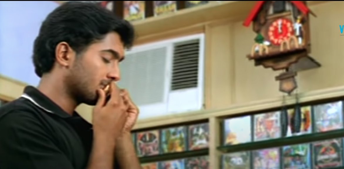 Venu being a typical Telugu boy in the early 2000s by kissing a gift his childhood sweetheart gave and playing the harmonium around the city to unsuspecting bystanders