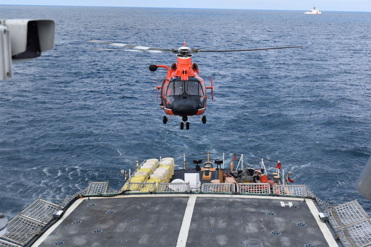 USCGLANTAREA's tweet photo. A #USCG MH-65 Dolphin Short Range Recovery #Helicopter hovers above #USCGC #CAMPBELL during helicopter landing operations in the #DavisStrait in between #Greenland and #BaffinIsland #Argus #OpNanook https://t.co/I6KgC9PMtj