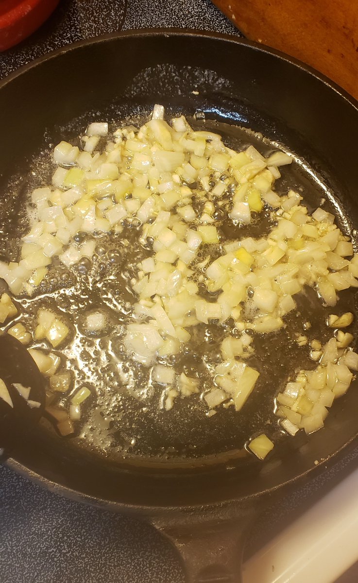 Started browning the onion and "dusted" the chicken parts. Note that Google was not helpful in telling me the difference between "dusting" and "dredging" but I figure either way it means to put some flower on those puppies and shake off the excess.