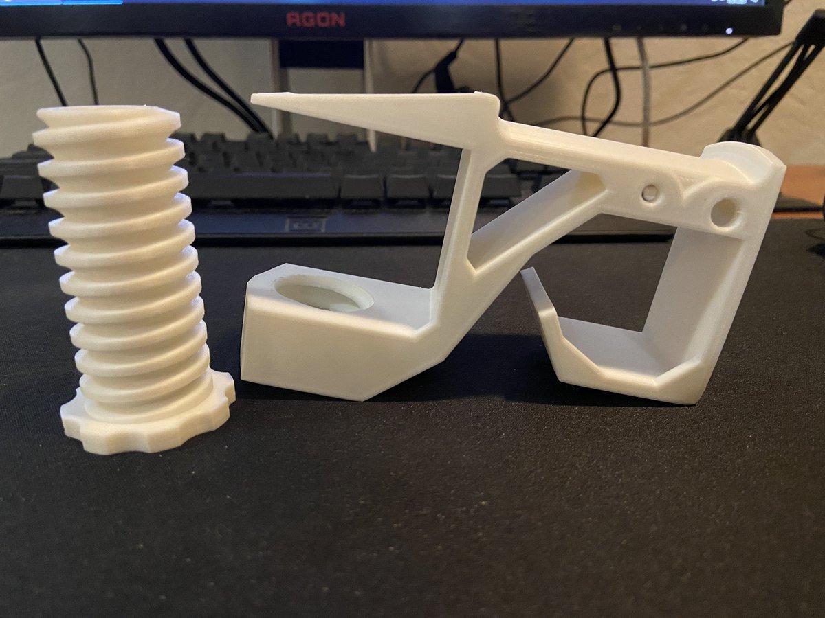 First actual useful print: a headset holder!Printed super warped since the heat bed turned off halfway through (curse you eco mode!) but still came out functional so I call it a win. Doing another hook for my roommate with corrected settings so we’ll see how it goes.