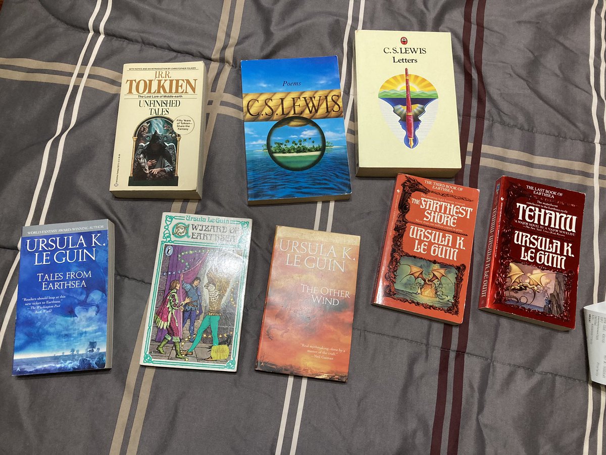 #TolkienEveryday Day 31 My most recent thrift store haul, an unread copy of Unfinished Tales from 1988, 2 CS Lewis collections and an assortment of Le Guin books!