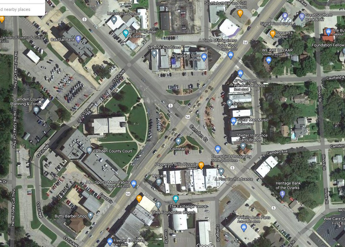 Another common scenario is widening the highway through the center of town, effectively killing off anything attractive about the place. Here's Camdenton, MO, which is my nominee for saddest courthouse square in the state. Highway 54 rammed right through the square