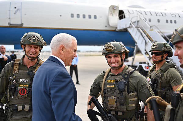 usually these tend to be comparatively subdued - thin blue line and punisher motifs, ‘1*’ (one ass to risk), and so on, rather than the open contempt you see upthread. not always, though, like the Florida SWAT officer who met Mike Pence with a QAnon patch on his plate carrier