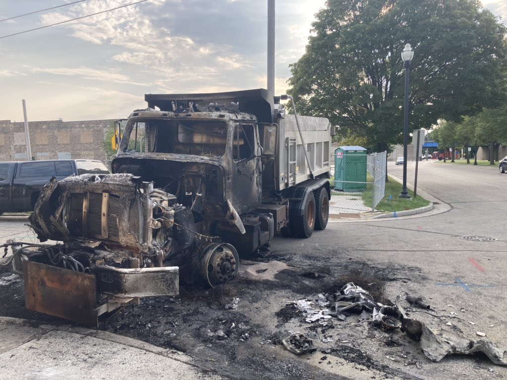 Damaged and burned out Kenosha city trucks.