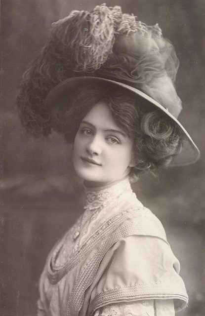 Edwardian “Merry Widow” hats featured wide brims, and were adorned with large feathers.