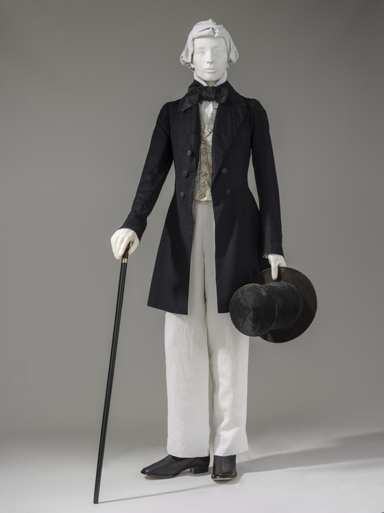 Top hats and ascots were popular accessories. During the earlier part of the Victorian era, men’s coats were long, ending mid-calf. Dramatic cloaks or capes were also worn.