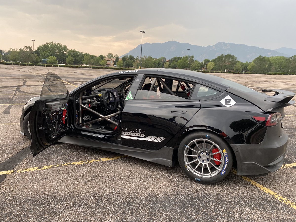 Sofiaan's tweet photo. It’s cozy in this #Tesla race car. The @UnpluggedTesla guys have to do some tricks to make the car think nothing is missing (or added) 😂 https://t.co/ZLM4vS00Mm