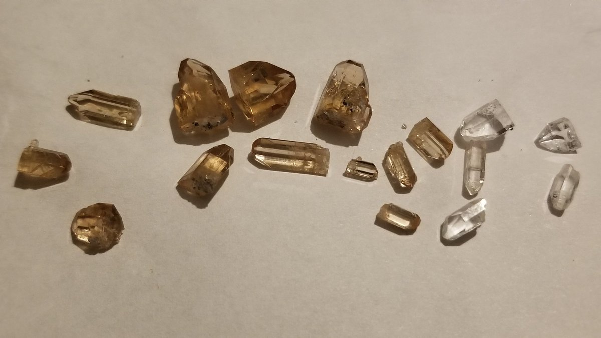 and this is why i wentFUN FACT: Topaz will "bleach" from the sun and eventually lose their color. The ones on the right were found on the ground while the ones on the left were found inside rocks.