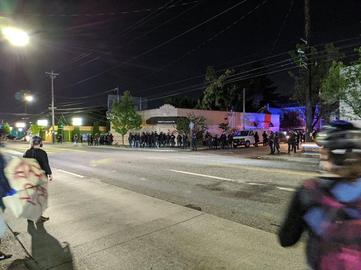 Back to the PPA, where a cluster of cops stand silently guarding the beige building