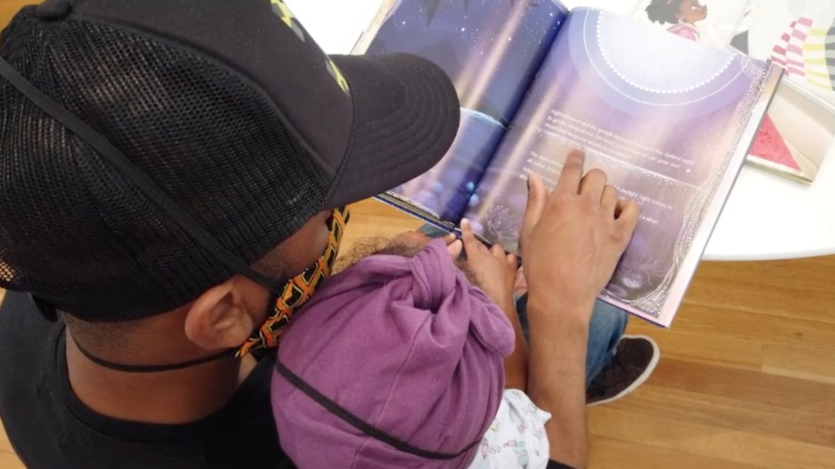 Musician Sizz of <a href="/MilknSizz/">Milk + Sizz</a> reads aloud from <a href="/Lupita_Nyongo/">Lupita Nyong'o</a>'s SULWE to his young daughter outside the new <a href="/HighMuseumofArt/">High Museum of Art</a> exhibit "Picture The Dream" -- which explores the Civil Rights Movement through children's picture books.  <a href="/GoodDayAtlanta/">Good Day Atlanta</a> #fox5atl