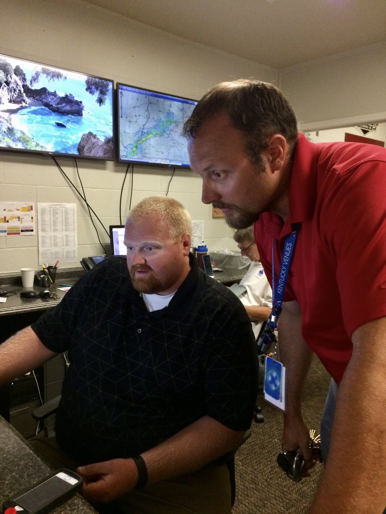 This is Tim and Chris, working in the Emergency Operations Center. There was severe weather coming & they were monitoring it in case they had to shut down the tents or midway (they did, temporarily). They also have the best sunglass tan lines, obvs.