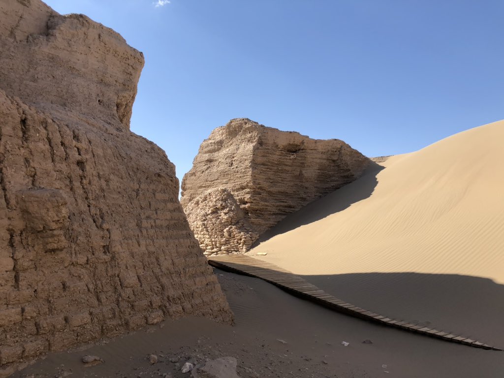 Now arid and desiccated, the city (whose Tangut name means ‘Black Water’) was fed by now reduced aquifers. Nearby are the ghostly remains of a forest which died when the local water table dropped. Sands now lap the bastion walls and cover the city’s remaining buildings. 4/5