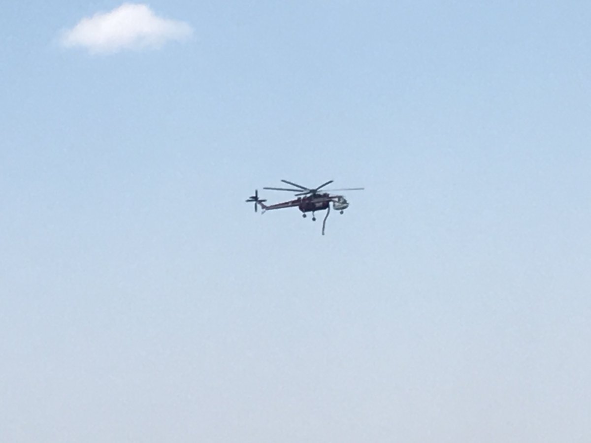 ranflyer's tweet photo. what a day for air power. now they have a tanker, slurry bombers and helicopters all flying directly over our ranch to lay down a water/chemical defense. slight wind change is spreading the advance fire line out. #forestfiressuck #WillisCreekfire_CO https://t.co/E6fFtYszso
