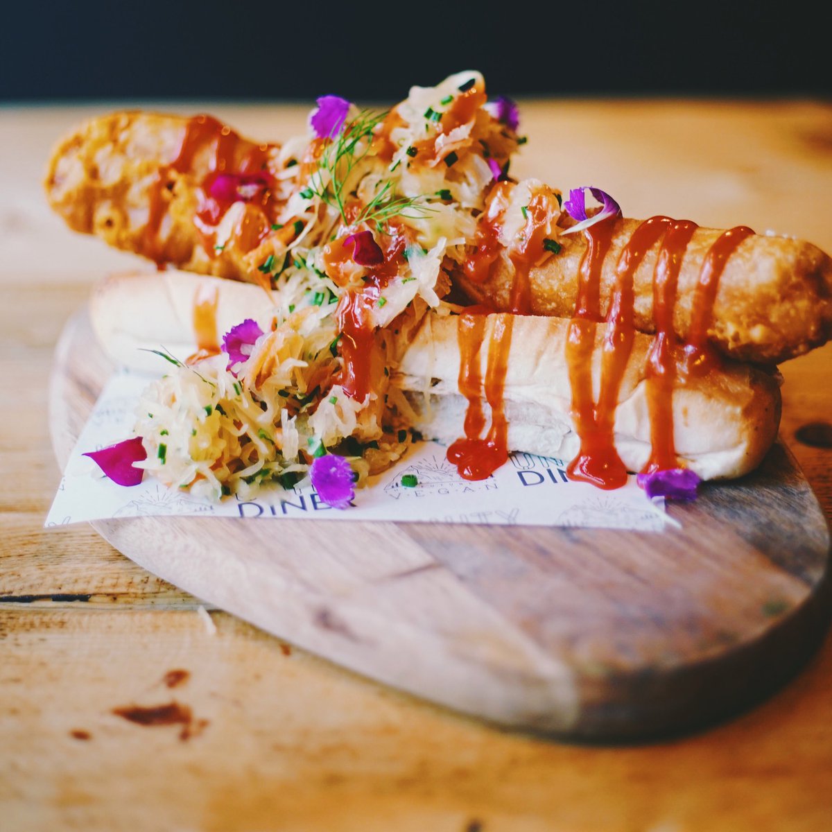 We know you guys like our hot dogs, so we deep fried one, and we think you might like it even more 👀 ⁣⁣ ⚡️ The Surge Dog ⚡️⁣⁣ Deep-fried battered moving mountains hot dog, sauerkraut, ketchup and crispy onions 🔥 ⁣⁣