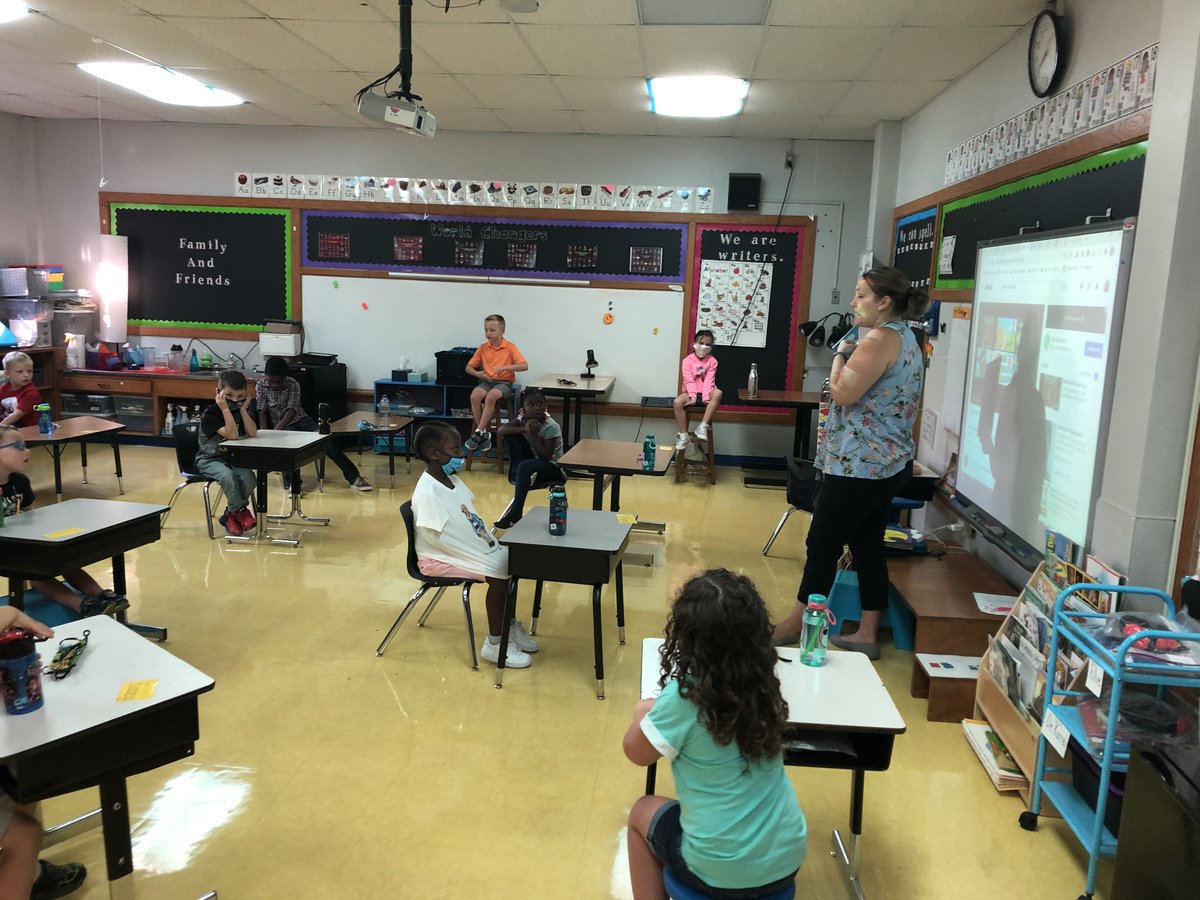 Ms. Steinman prepares for a read aloud with her kindergarten students.  Our first days have been a success!