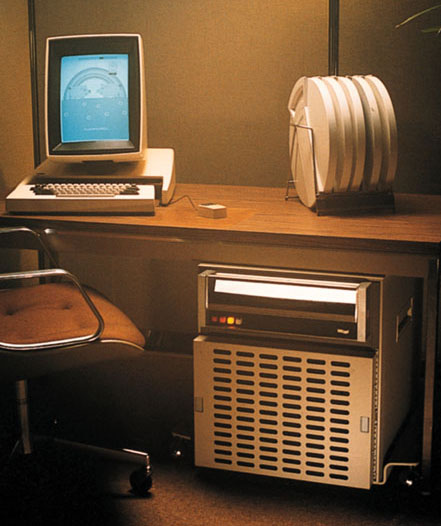 Xerox Alto, 1973. The first GUI, the first mouse, the first "desktop."Followed by the Xerox Star.