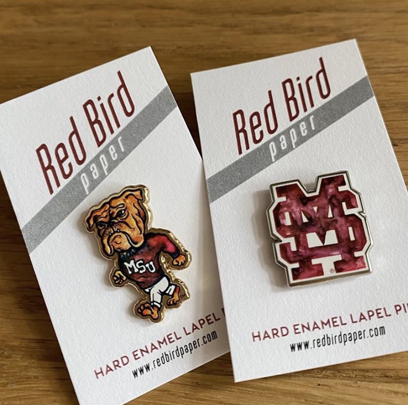 RedBirdPaper's tweet image. ✨NEW✨ hard enamel lapel pens available now at redbirdpaper.com! These classic lapel pins, with military clutch backings, feature @RedBirdPaper watercolor MState vault artwork. #HailState