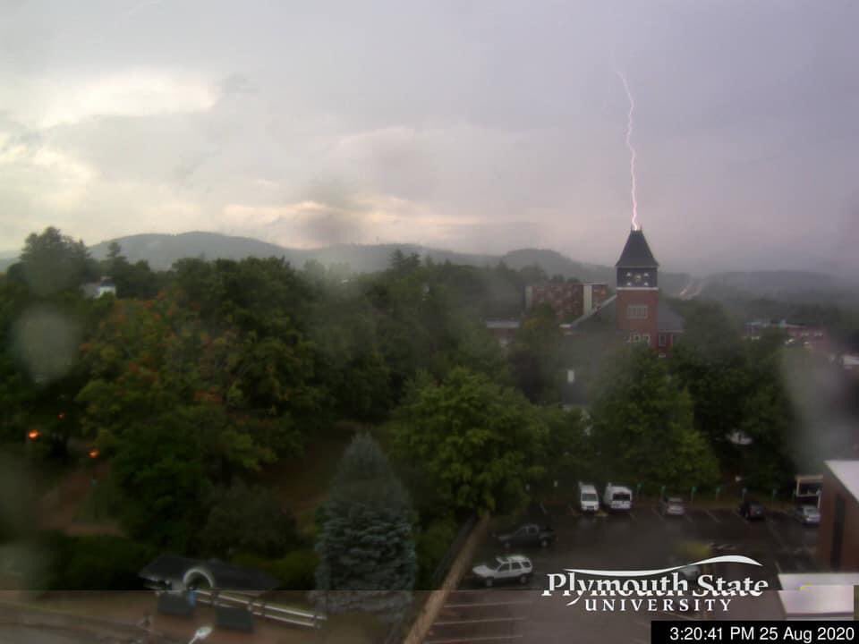 jaycordeira's tweet photo. It would appear lightning struck the @PlymouthState Rounds Clock Tower today at 3:20 PM via the Plymouth State meteorology webcam (or struck in the background giving the perspective of a foreground strike). #NHwx https://t.co/1plCohhbBL