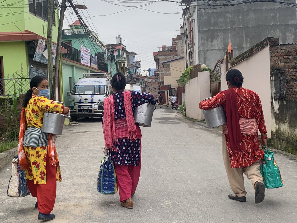 srpaudel's tweet photo. Maintaining physical distance👌, women are on their way to market carrying cow milk. #corona🦠hour, #syuchatar #kathmandu https://t.co/K9SzNMuA2p