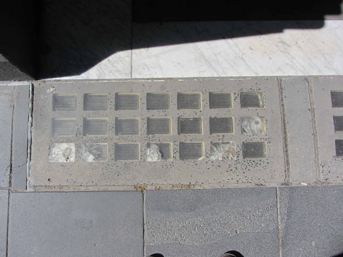 by the early 20th century, advances in glass block strength meant that a higher amount of the surface area of pavement lights could be glass. thus, contemporary pavement lights are more like skylights than deck prisms. (Collins St, Melbourne)  https://pavementlights.melbourne/gallery-of-recent-work/